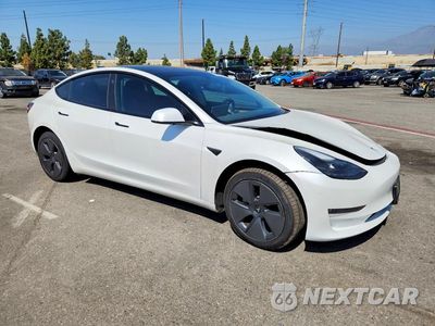 Czwarte zdjęcie samochodu z boku: 2022 TESLA MODEL 3 VIN:5YJ3E1EB2NF168567 - miniatura