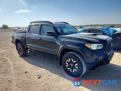 Czwarte zdjęcie samochodu z boku: 2023 TOYOTA TACOMA TRD OFF-ROAD VIN:3TMCZ5AN9PM587459 - miniatura