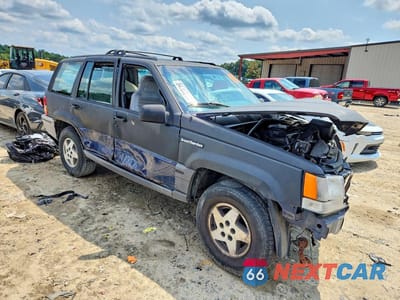 Czwarte zdjęcie samochodu z boku: 1993 JEEP GRAND CHEROKEE LAREDO VIN:1J4GZ58Y4PC681732 - miniatura