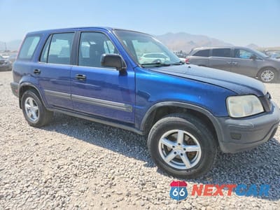 Czwarte zdjęcie samochodu z boku: 1999 HONDA CR-V LX VIN:JHLRD1849XC002544 - miniatura