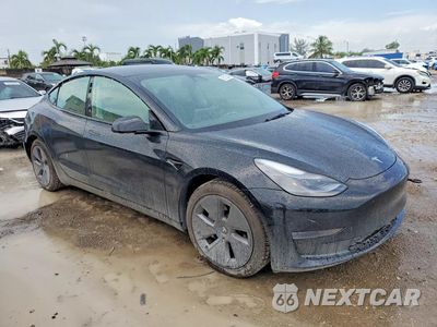 Czwarte zdjęcie samochodu z boku: 2023 TESLA MODEL 3 VIN:5YJ3E1EA5PF558511 - miniatura