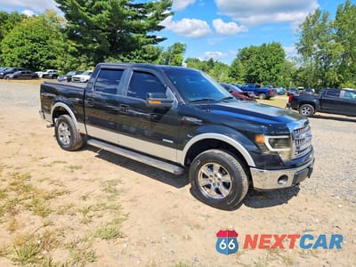 Czwarte zdjęcie samochodu z boku: 2014 FORD F150 SUPERCREW LARIAT VIN:1FTFW1ET3EKD54818 - miniatura