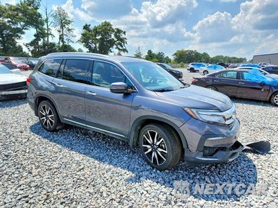 Czwarte zdjęcie samochodu z boku: 2019 HONDA PILOT TOURING VIN:5FNYF5H61KB034170 - miniatura