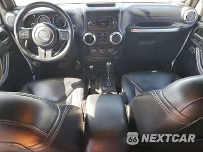 Zdjęcie 8 z 13 samochodu: 2015 JEEP WRANGLER UNLIMITED SAHARA VIN:1C4BJWEGXFL641162 - miniatura