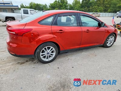 Trzecie zdjęcie samochodu z tyłu: 2018 FORD FOCUS SE VIN:1FADP3F29JL286234 - miniatura