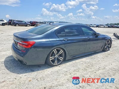 Trzecie zdjęcie samochodu z tyłu: 2016 BMW 740 I VIN:WBA7E2C57GG547414 - miniatura