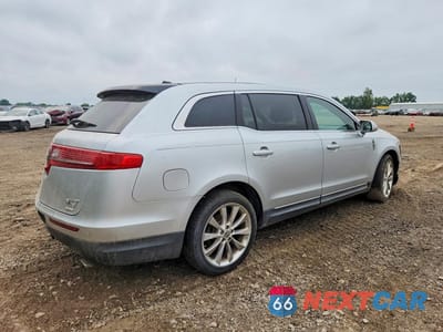 Trzecie zdjęcie samochodu z tyłu: 2012 LINCOLN MKT VIN:2LMHJ5AT9CBL54379 - miniatura