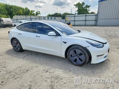 Czwarte zdjęcie samochodu z boku: 2023 TESLA MODEL 3 VIN:5YJ3E1EA5PF489884 - miniatura