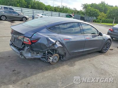 Trzecie zdjęcie samochodu z tyłu: 2023 TESLA MODEL 3 VIN:5YJ3E1EA5PF678003 - miniatura