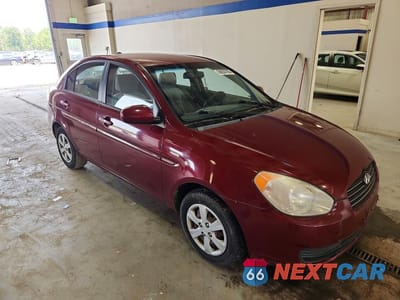 Czwarte zdjęcie samochodu z boku: 2010 HYUNDAI ACCENT GLS VIN:KMHCN4AC7AU427583 - miniatura