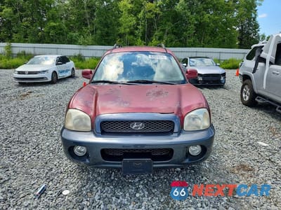 Piąte zdjęcie samochodu w środku: 2003 HYUNDAI SANTA FE GLS VIN:KM8SC13E93U461851 - miniatura