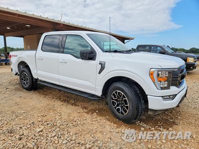 Czwarte zdjęcie samochodu z boku: 2021 FORD F150 SUPERCREW VIN:1FTFW1E85MFC34134 - miniatura