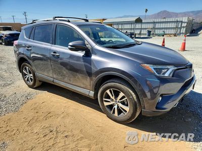 Czwarte zdjęcie samochodu z boku: 2018 TOYOTA RAV4 XLE VIN:JTMWFREV0JJ173899 - miniatura