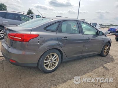 Trzecie zdjęcie samochodu z tyłu: 2015 FORD FOCUS SE VIN:1FADP3F2XFL347131 - miniatura