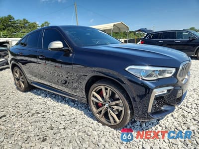 Czwarte zdjęcie samochodu z boku: 2021 BMW X6 M50I VIN:5UXCY8C03M9E36666 - miniatura