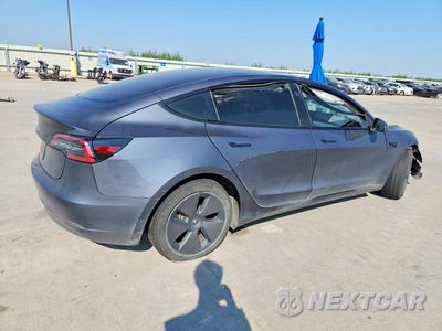 Trzecie zdjęcie samochodu z tyłu: 2023 TESLA MODEL 3 VIN:5YJ3E1EA3PF614493 - miniatura