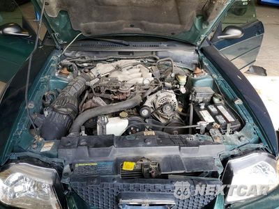 Zdjęcie 11 z 12 samochodu: 2000 FORD MUSTANG VIN:1FAFP4449YF186601 - miniatura