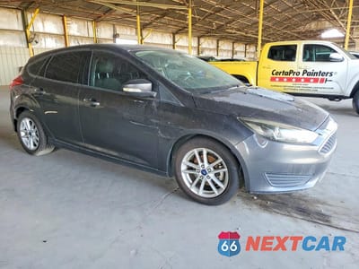 Czwarte zdjęcie samochodu z boku: 2017 FORD FOCUS SE VIN:1FADP3K29HL216572 - miniatura