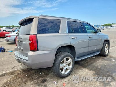 Trzecie zdjęcie samochodu z tyłu: 2019 CHEVROLET TAHOE C1500 LT VIN:1GNSCBKC7KR109676 - miniatura