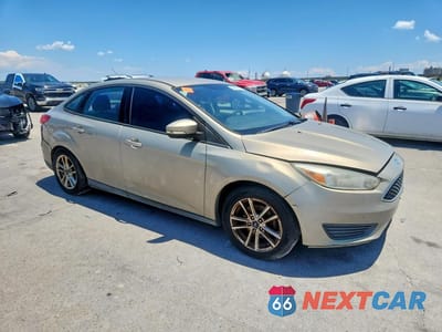 Czwarte zdjęcie samochodu z boku: 2016 FORD FOCUS SE VIN:1FADP3F29GL316213 - miniatura