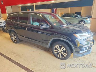 Czwarte zdjęcie samochodu z boku: 2017 HONDA PILOT EXL VIN:5FNYF6H54HB093686 - miniatura
