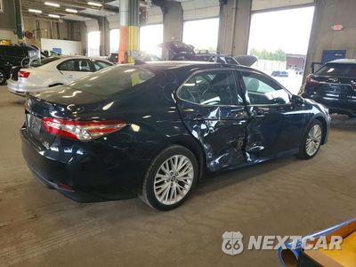 Trzecie zdjęcie samochodu z tyłu: 2019 TOYOTA CAMRY HYBRID XLE VIN:4T1B21HK3KU516021 - miniatura