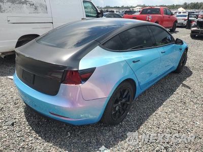Trzecie zdjęcie samochodu z tyłu: 2022 TESLA MODEL 3 VIN:5YJ3E1EC5NF125303 - miniatura
