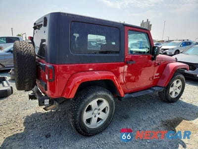 Trzecie zdjęcie samochodu z tyłu: 2010 JEEP WRANGLER SAHARA VIN:1J4AA5D14AL162290 - miniatura