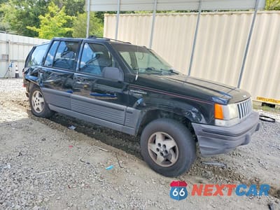 Czwarte zdjęcie samochodu z boku: 1994 JEEP GRAND CHEROKEE LAREDO VIN:1J4FX58S7RC283897 - miniatura