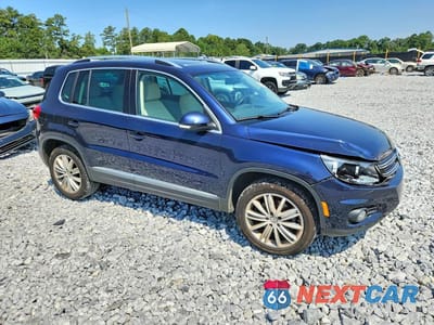 Czwarte zdjęcie samochodu z boku: 2015 VOLKSWAGEN TIGUAN S VIN:WVGAV7AX2FW592898 - miniatura