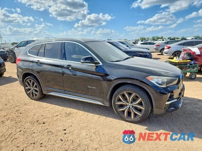 Czwarte zdjęcie samochodu z boku: 2017 BMW X1 SDRIVE28I VIN:WBXHU7C35H5H34790 - miniatura