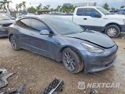 Czwarte zdjęcie samochodu z boku: 2021 TESLA MODEL 3 VIN:5YJ3E1EB2MF091410 - miniatura