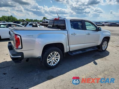 Trzecie zdjęcie samochodu z tyłu: 2016 GMC CANYON SLT VIN:1GTG6DE39G1113523 - miniatura