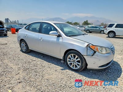 Czwarte zdjęcie samochodu z boku: 2010 HYUNDAI ELANTRA BLUE VIN:KMHDU4AD0AU831552 - miniatura