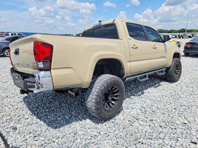 Trzecie zdjęcie samochodu z tyłu: 2019 TOYOTA TACOMA SR5 V6 VIN:3TMAZ5CN7KM093484 - miniatura