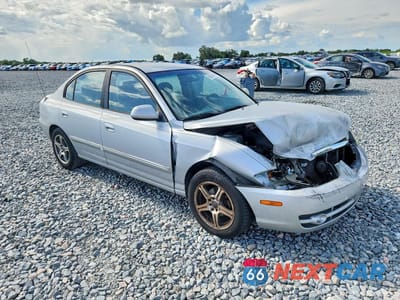Czwarte zdjęcie samochodu z boku: 2004 HYUNDAI ELANTRA GLS VIN:KMHDN46D84U821698 - miniatura