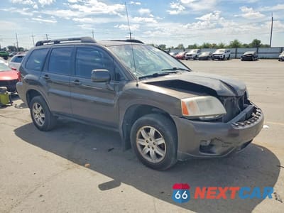 Czwarte zdjęcie samochodu z boku: 2011 MITSUBISHI ENDEAVOR LS VIN:4A4JN2AS0BE011645 - miniatura