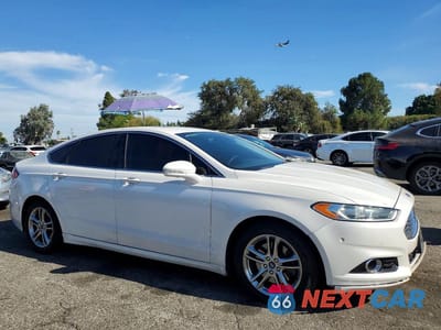 Czwarte zdjęcie samochodu z boku: 2016 FORD FUSION TITANIUM PHEV VIN:3FA6P0SU5GR157013 - miniatura