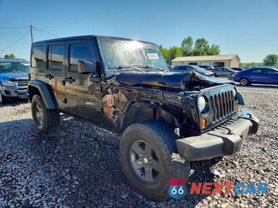 Czwarte zdjęcie samochodu z boku: 2011 JEEP WRANGLER UNLIMITED RUBICON VIN:1J4BA6H17BL593471 - miniatura