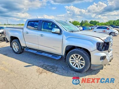 Czwarte zdjęcie samochodu z boku: 2016 GMC CANYON SLT VIN:1GTG6DE39G1113523 - miniatura