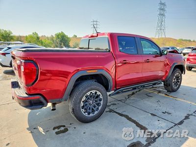 Trzecie zdjęcie samochodu z tyłu: 2026 GMC CANYON AT4 VIN:1GTP2DEK8T1103076 - miniatura