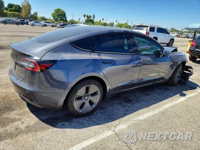 Trzecie zdjęcie samochodu z tyłu: 2022 TESLA MODEL 3 VIN:5YJ3E1EBXNF171572 - miniatura
