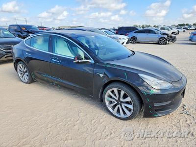 Czwarte zdjęcie samochodu z boku: 2019 TESLA MODEL 3 VIN:5YJ3E1EB0KF195617 - miniatura