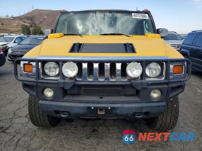 Piąte zdjęcie samochodu w środku: 2003 HUMMER H2 VIN:5GRGN23U93H121690 - miniatura