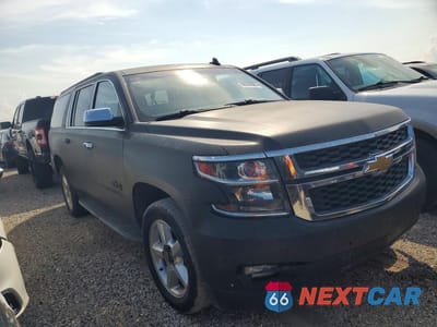 Czwarte zdjęcie samochodu z boku: 2015 CHEVROLET SUBURBAN C1500 LT VIN:1GNSCJKCXFR628365 - miniatura
