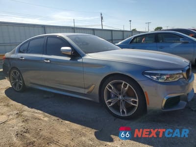 Czwarte zdjęcie samochodu z boku: 2018 BMW M550XI VIN:WBAJB9C5XJB035853 - miniatura