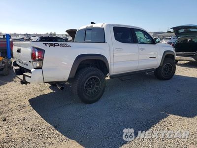 Trzecie zdjęcie samochodu z tyłu: 2021 TOYOTA TACOMA TRD OFF-ROAD VIN:3TMAZ5CNXMM141563 - miniatura