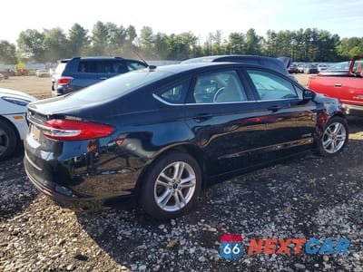 Trzecie zdjęcie samochodu z tyłu: 2018 FORD FUSION S HYBRID VIN:3FA6P0UU5JR122217 - miniatura