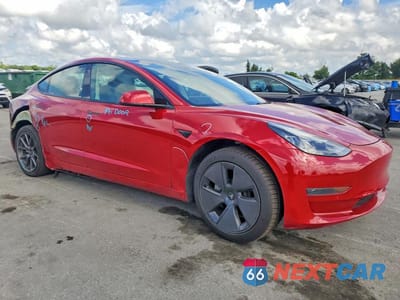 Czwarte zdjęcie samochodu z boku: 2022 TESLA MODEL 3 VIN:5YJ3E1EAXNF184796 - miniatura