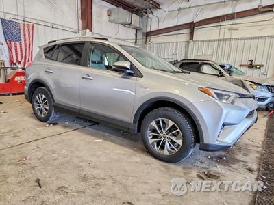 Czwarte zdjęcie samochodu z boku: 2017 TOYOTA RAV4 HYBRID XLE VIN:JTMRJREV8HD119738 - miniatura